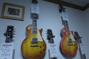 Two 1960 Gibson Les Pauls hang in Dave Rogers's personal collection at Dave's Guitar Shop.