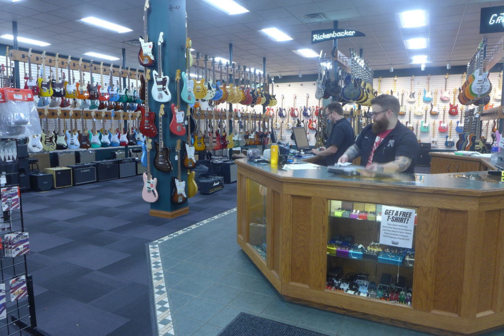 Employees at Dave's Guitar Shop. 