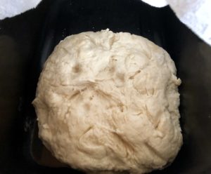 Frybread dough rests in a bowl, waiting to be fried. 