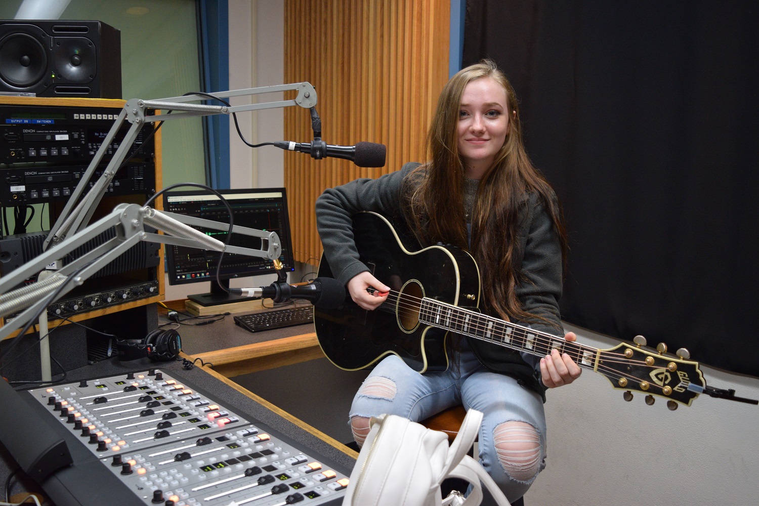 Coyote Johnson plays guitar and recorded her song "Stuck On You" in WPR's studios. (Maureen MCCollum/WPR)