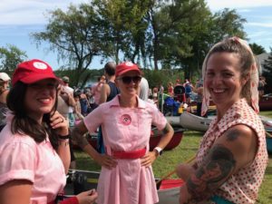“A League of Their Own,” from left Katie Buttke, Deanna Linzmeier and Chamomile Nusz, are current and past champions of PaddleQuest. (Rob Mentzer/WPR)