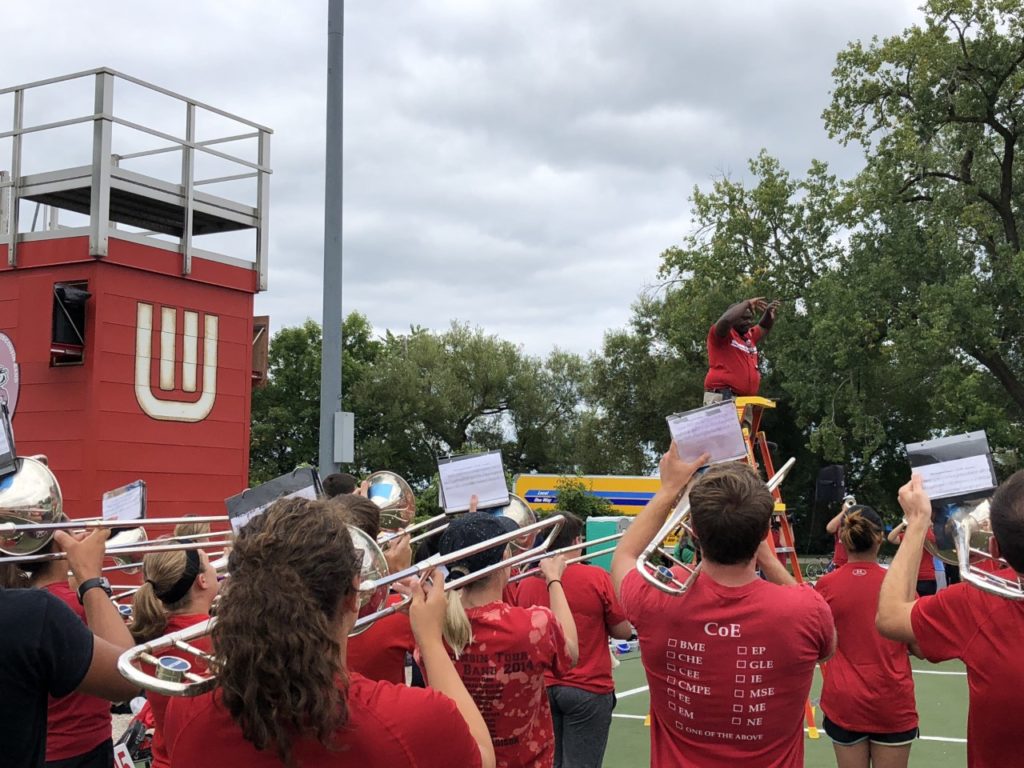 Dr. Corey Pompey commands the podium as the first new marching band director at UW-Madison in half a century. (Tim Peterson/WPR)