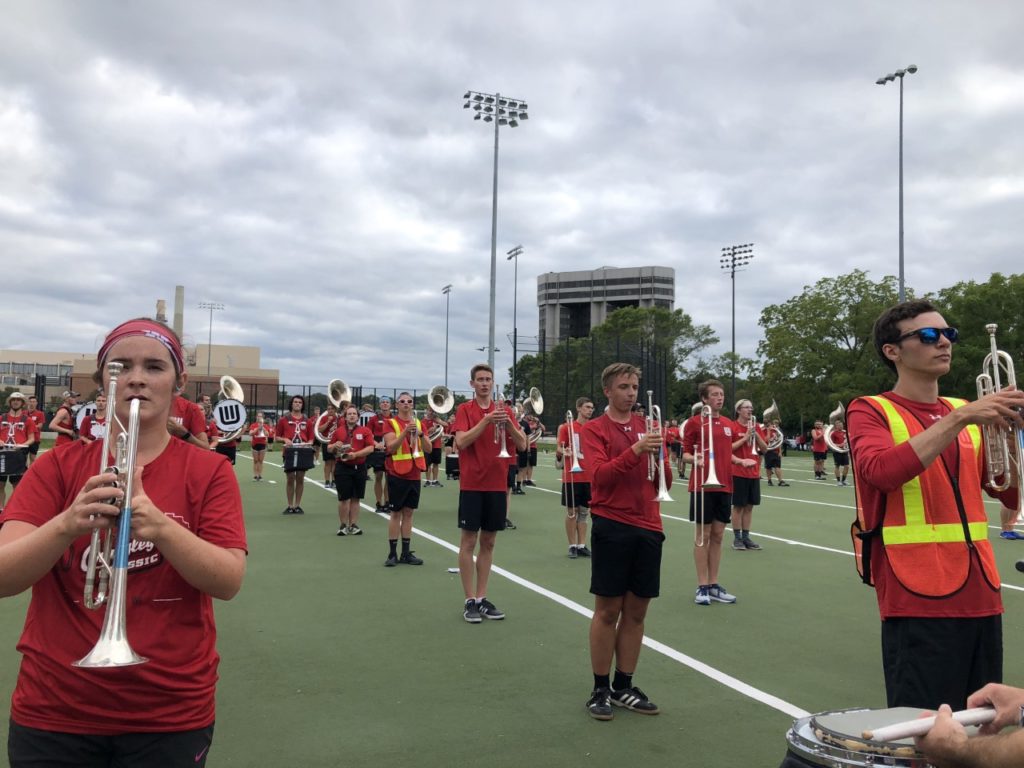 After a music and physical warm-up, the UW-Madison Marching Band rehearses the drill sets for their halftime show. (Tim Peterson/WPR)