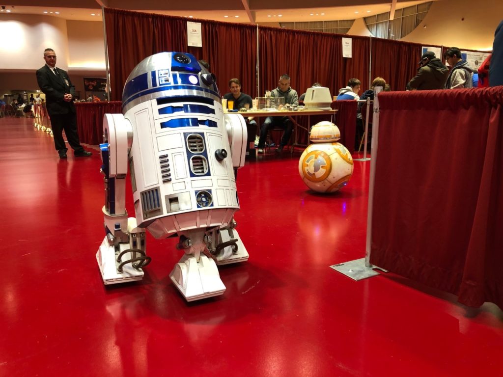 R2-D2 and BB-8 droids built in Wisconsin roll together at the Madison Mini Maker Faire in November 2019. (Maureen McCollum/WPR)