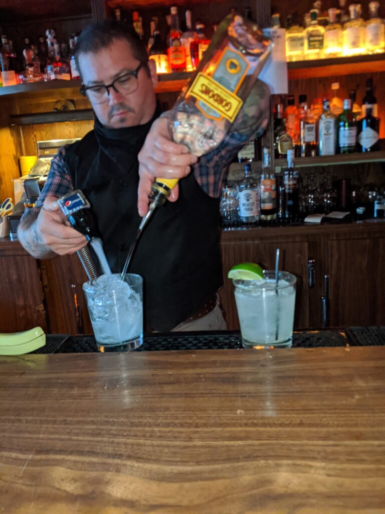 Bartender Jeff Kinder makes a cocktail during The Jazz Estate's reopening. (Photo by Andy Turner)