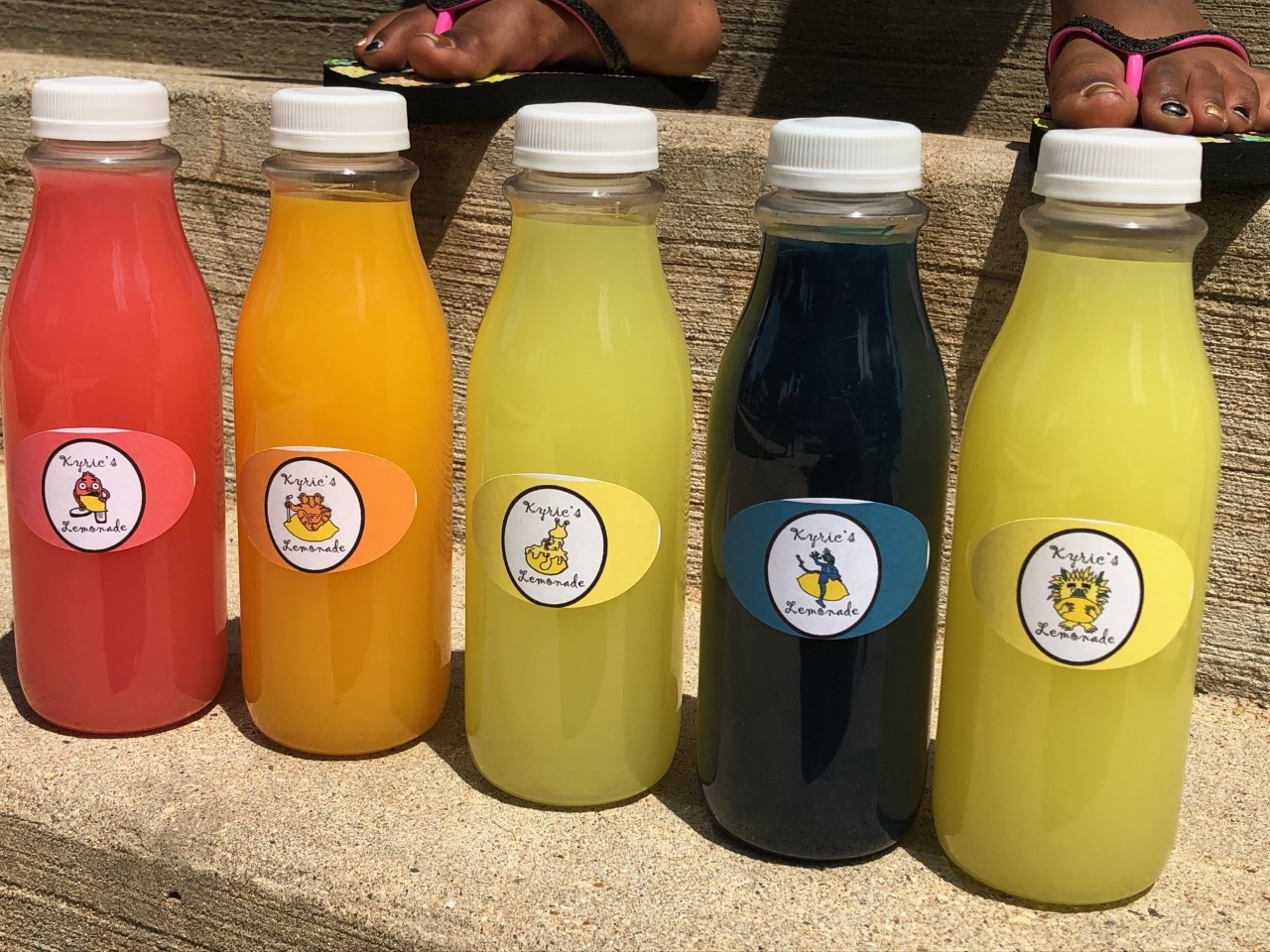 Kyric's Lemonade comes in five flavors: pink, orange, regular, blue, and pineapple. (Maureen McCollum/WPR)